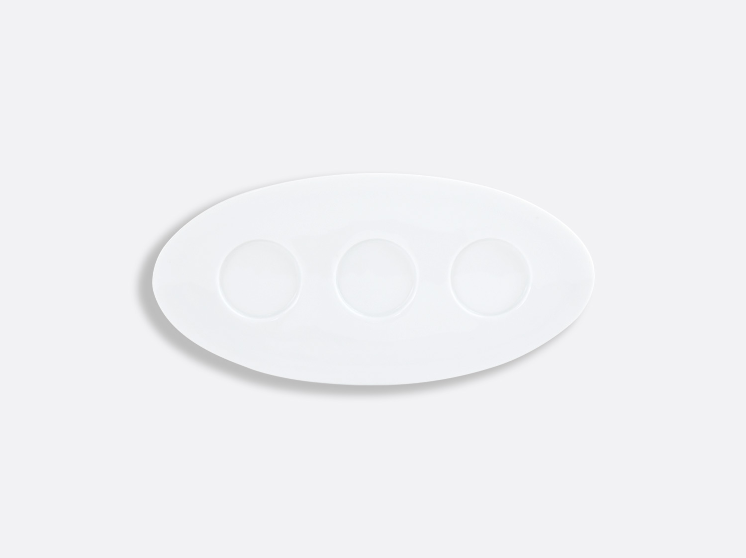 Assiette ovale support 3 timbales 26,6 cm en porcelaine de la collection Lounge Blanc Bernardaud